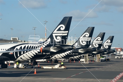 The tails of four Air New Zealand jets dominate Auckland Airport