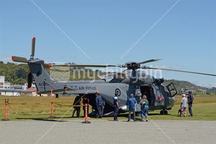 Civilians inspect an Air Force NH90 helicopter  at an open day in Greymouth  run by the New Zealand armed forces. The NH90 was built by NATO Helicopter Industries (NHI) (France).