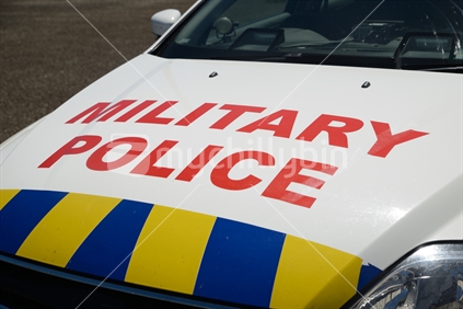Signage on the bonnet of a military police car.
