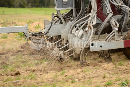 Detail of an air seeder used for sowing seed on old pasture, West Coast, New Zealand.