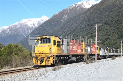 OTIRA, NEW ZEALAND, SEPTEMBER 6, 2018: A passenger train, the Tranz Scenic, navigates the Southern Alps near Otira village.