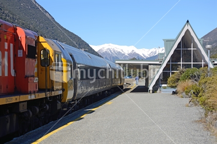 Arthur's Pass railway station with a passenger train from Dunedin, in the Southern Alps, Westland, New Zealand.