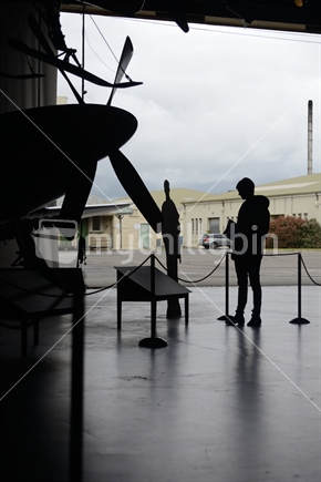 CHRISTCHURCH, NEW ZEALAND, DECEMBER 12, 2018: Silhouette of an unknown visitor to the Air Force Museum.