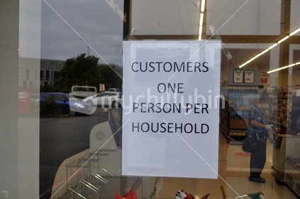 Signage at a supermarket  limits customer access during the Covid 19 lockdown in New Zealand, March 2020 (Very slight photographer reflection in image)