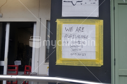 Signage shows that a non-essential business in Greynouth has restricted access during the Covid 19 lockdown in New Zealand, March 2020