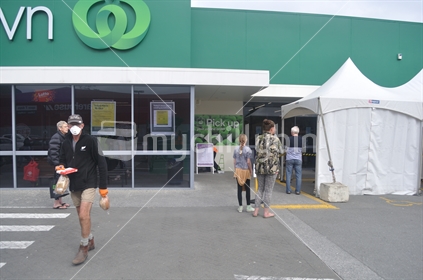 GREYMOUTH, NEW ZEALAND, APRIL 11, 2020: Customers wait to enter a supermarket during the Covid 19 lockdown in New Zealand, April 11,  2020