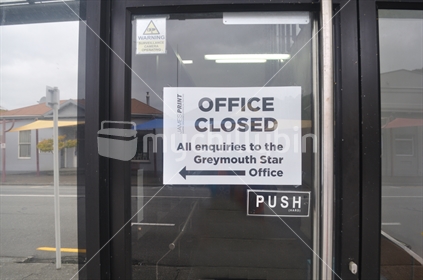 GREYMOUTH, NEW ZEALAND, APRIL 11, 2020: Signage on a business closed down for the Covid 19 lockdown in New Zealand, April 11,  2020