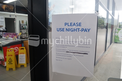 Signage at a petrol station in Greymouth urges customers to use contactless payment methods during the Covid 19 lockdown in New Zealand, April 11,  2020