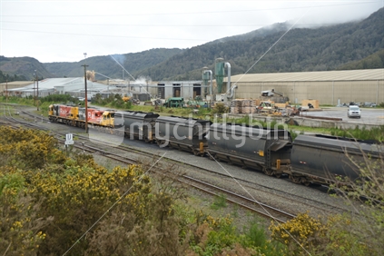 STILLWATER, SOUTH ISLAND, NEW ZEALAND, OCTOBER 25, 2019: A train with wagons full of coal waits on the siding at Stillwater, West Coast, New Zealand
