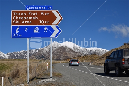 PORTERS PASS, NEW ZEALAND, SEPTEMBER 20, 2020:  Signage directs traffic to the Cheeseman Ski Area off State Highway 73 near Porters Pass. The Torlesse Range can be seen in the background.
