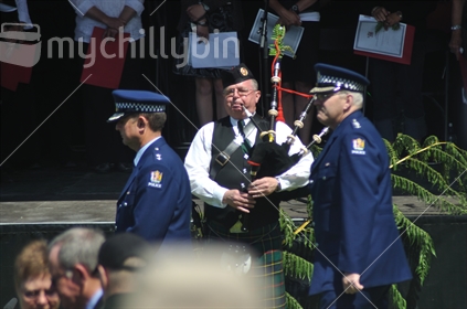 Piper plays as Police and other dignitaries pay their respects at the 2010 Memorial Service for 29 coal miners killed in the Pike River coal mine near Greymouth, West Coast,
