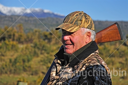 Portrait of a pheasant hunter  on the West Coast, South Island, New Zealand