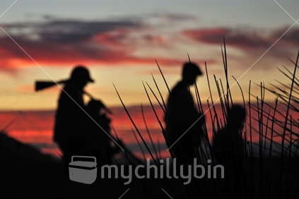 Successful pheasant hunters head home at sunset on the West Coast, South Island, New Zealand