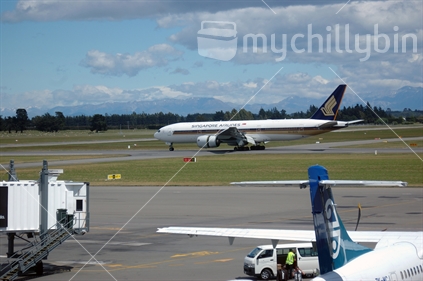 Singapore Airlines passenger jet taxis out on tarmac in Christchurch, New Zealand
