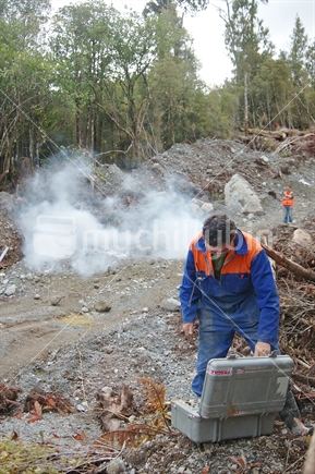 Geologist firing an explosive charge for a seismic test on the West Coast