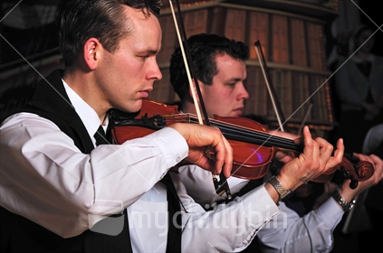 Violinists performing in live New Zealand concert
