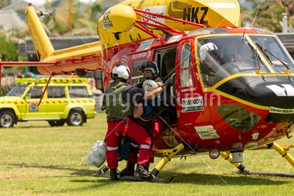 Helping a rescued person from the Westpac Rescue Helicopter