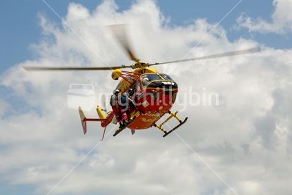 Westpac Rescue Helicopter flying with injured patient 