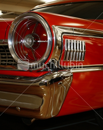 A sixties classic car chrome detailing and taillight.