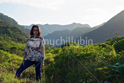 Early morning portrait in the outdoors, at remote Whatipu, in the Waitakere Ranges, Auckland, New Zealand. 