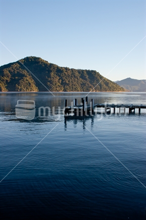 Shelly Beach wharf on a crisp and clear blue sky morning, Picton, Queen Charlotte Sound, Marlborough Sounds.