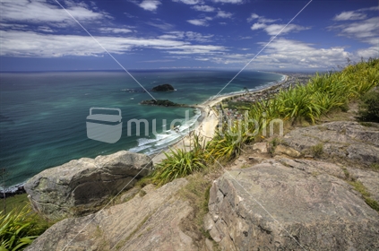 Rocks on the top of Mount Maunganui (Mauao), and view into the distance; New Zealand.
