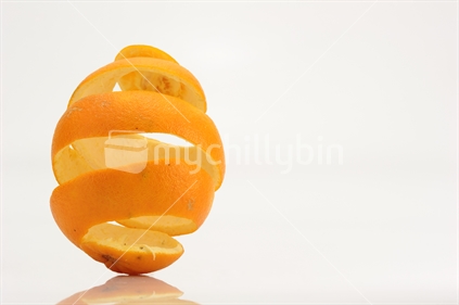 Orange peel in a spiral shape, izolated on white.
New Zealand orange peel, in a spiral shape, isolated on white.
