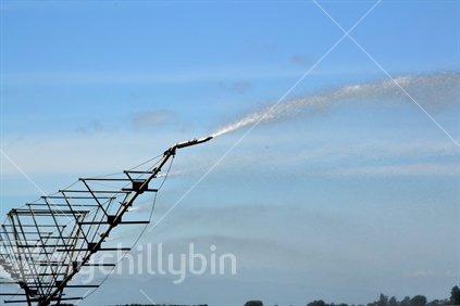 Irrigating pasture in Mid-Canterbury. Spray jets on rotary irrigator
