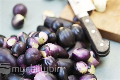 Eggplant about to be cut up in kitchen