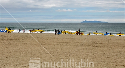 Children preparing for a surf lifesaving training session in the surf (near focus)