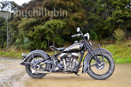 Vintage Indian motorbike parked on a remote Dunedin road.  
