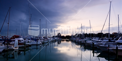 An eerie calm settles over Auckland's Pine Harbour Marina before an afternoon storm.