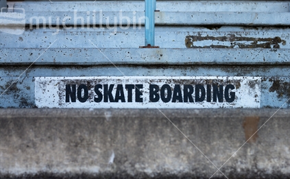 No skateboarding sign painted onto steps
