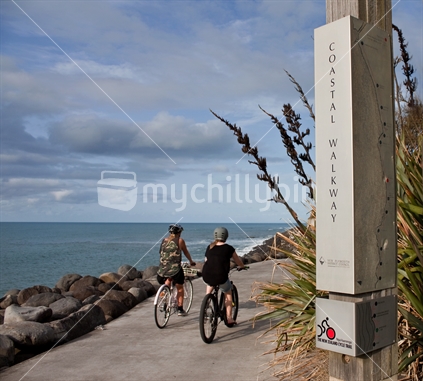 Cyclists biking on the New Plymouth coastal walkway