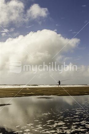 Single fisherman surfcasting.