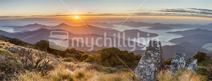 Sunrise over  Marlborough Sounds - viewed from top of Mt Stokes. Panoramic composition