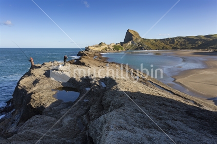 Castle Rock presides over  the lagoon of Deliverance Cove at Castlepoint, Wairarapa