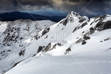 Snow slopes below summit of Mount Arthur in winter. Kahurangi National Park