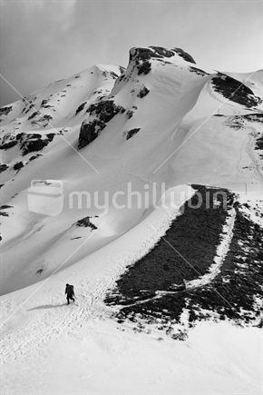 Lone mountain climber descends ice and snow ridge off Mount Arthur, Kahurangi National Park near Nelson