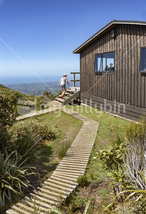 Pouakai Hut is a popular overnight stay en route the amazing view of Mt Taranaki volcano nearby