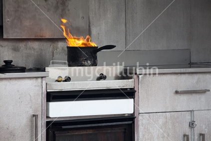 Flaming pot on an old kitchen stove