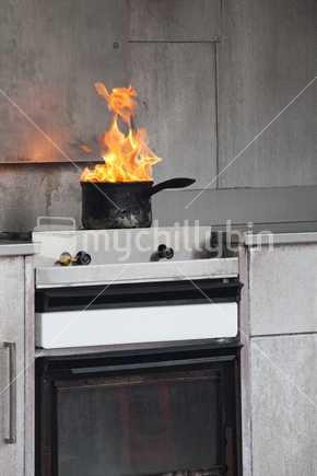 Flaming pot on an old kitchen stove