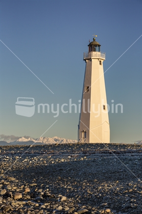 Boulder Bank Lighthouse, Nelson with Mount Arthur under winter snow