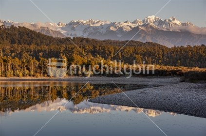 Southern Alps reflected in Three Mile Lagoon, Westland National Park