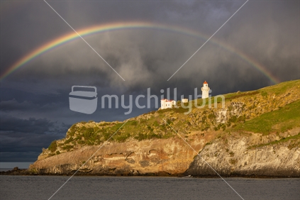 Rainbow over Tairoa Head lighthouse, Otago Peninsula