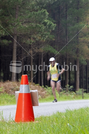 Blurred runner near the end of a 10Km harrier race