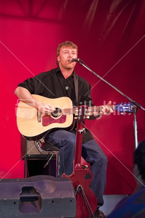 Dean Hetherington plays acoustic guitar in Nelson annual Arts Festival