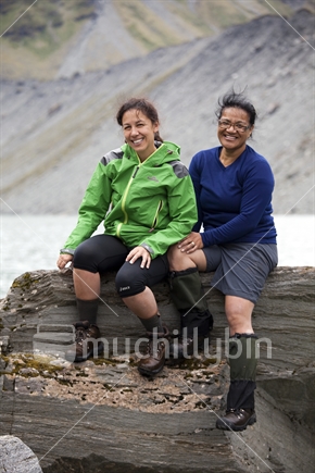 Two friends at Lucidus Lake in the remote Wilkin River of Mt Aspiring National Park, Otago