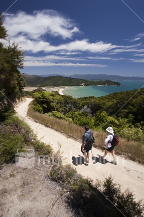 Walkers above Wainui Bay, Golden Bay, on the iconic Abel Tasman Track.