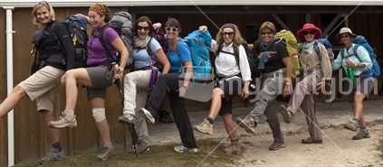 Eight middle-aged woman show a bit of leg at Mackay Hut. Heaphy Track, Kahurangi National Park (high ISO)
